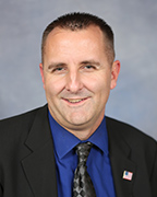 A portrait of a staff member